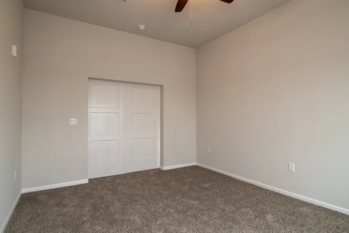 Union-Mill-Apartments-Wichita-Kansas-Two-Bedroom-Deluxe-Primary-Room-Door-Closed