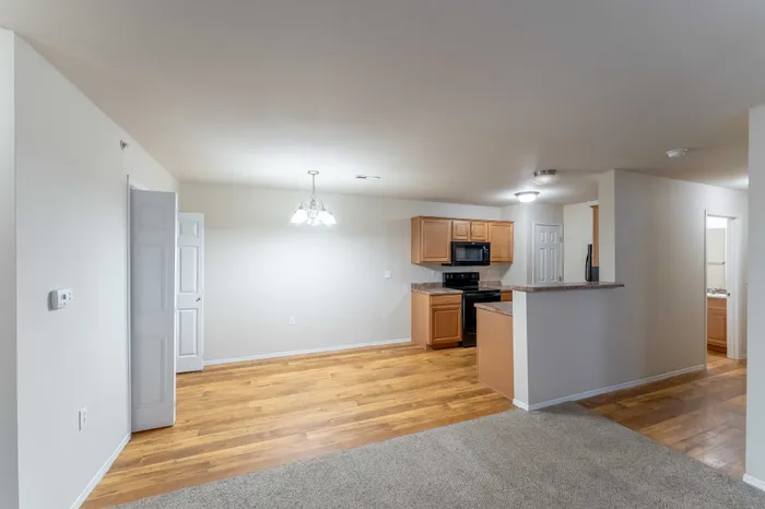 Coryell-Crossing-Apartments-Springfield-Missouri-Four-Bedroom-Dining-Room-And-Kitchen-View-From-Living-Room