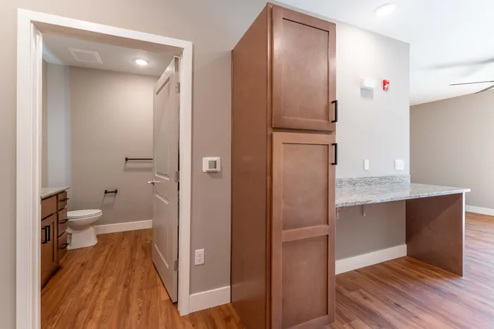Township-28-Apartments-Springfield-Missouri-Building-H-Studio-Premium-Kitchen-Storage-And-Bathroom-Entrance