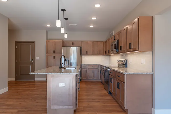 Township-28-Apartments-Springfield-Missouri-Building-H-Premium-Three-Bed-C-Kitchen-And-Front-Door