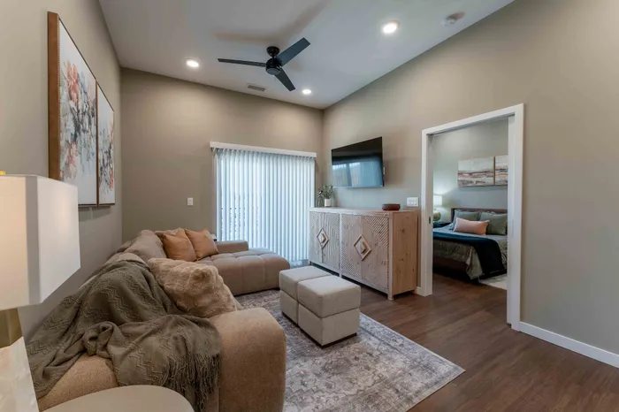 Heritage-Apartments-Springfield-Missouri-Bennett-Furnished-1-Bed-ADA-Unit-Living-Room-And-Bedroom-Entrance