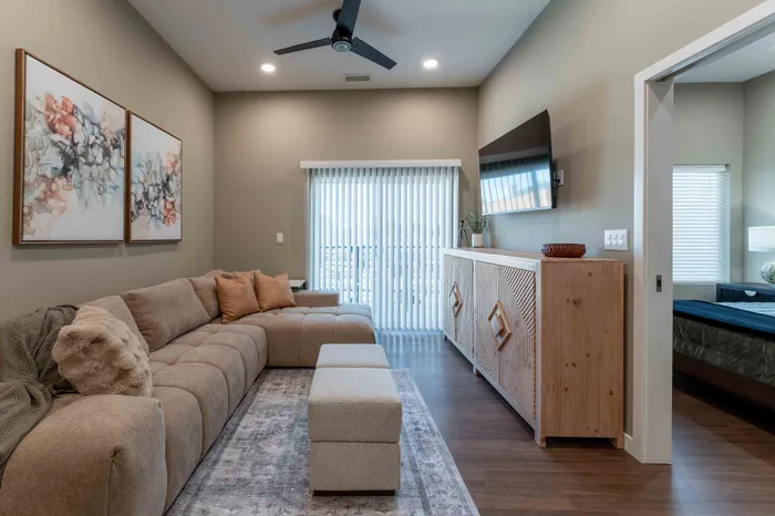 Heritage-Apartments-Springfield-Missouri-Bennett-Furnished-1-Bed-ADA-Unit-Living-Room-And-Patio-Doors