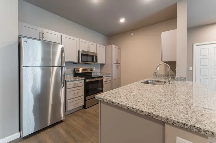 Coryell-Commons-Heights-Apartments-For-Rent-South-Springfield-Missouri-Two-Bed-Unit-104-Kitchen-Breakfast-Bar