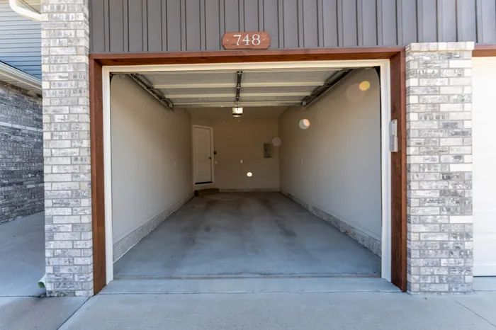 Oakwood-Heights-Townhomes-Republic-Missouri-Furnished-Two-Bed-Townhome-Open-Garage-Door-Exterior-View