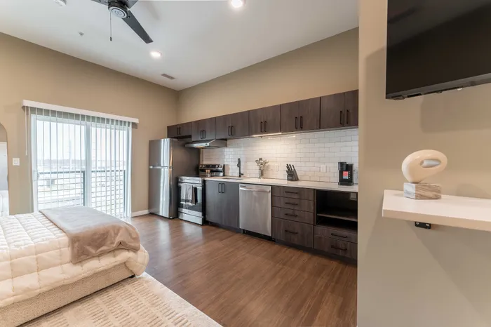 Heritage-Apartments-For-Rent-Springfield-Missouri-Furnished-Micro-Studio-Unit-405-Kitchen-And-Patio-Doors