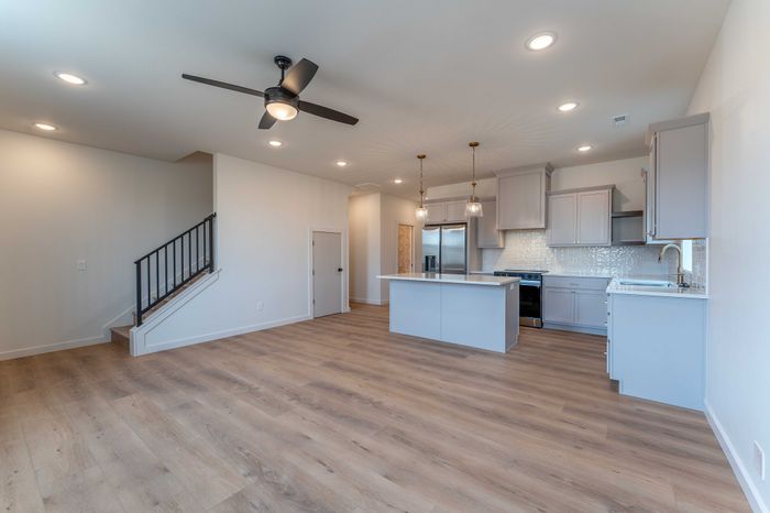 Owen-Silos-Subdivision-Luxury-Homes-South-Springfield-Missouri-Four-Bedroom-Cambridge-Unit-5765-Living-Room-To-Kitchen