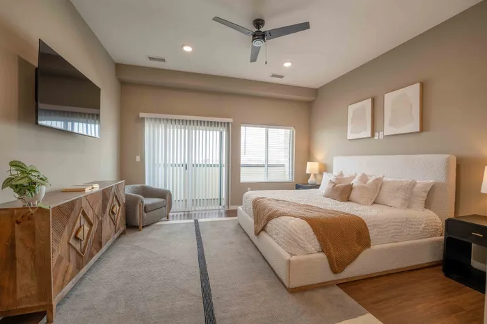 Heritage-Apartments-For-Rent-Springfield-Missouri-Furnished-Studio-Unit-515-Living-Space-And-Balcony-Doors