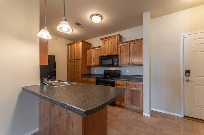 Coryell-Courts-Apartments-North-Springfield-Missouri-Studio-Olivia-Phase-Two-Kitchen-And-Front-Door