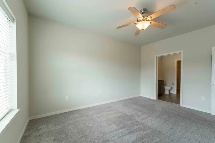 Monarch-Apartments-Springfield-Missouri-One-Bedroom-A-Primary-Bedroom-Bathroom-Door