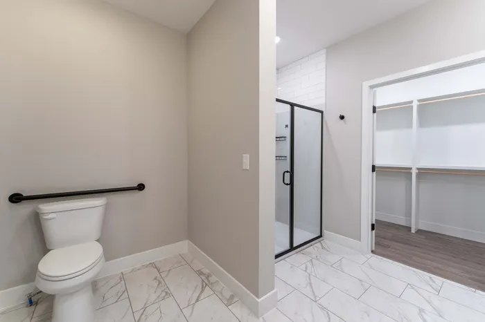 Villas-At-Anthony-Park-55-Plus-South-Springfield-Missouri-Three-Bedroom-Home-Primary-Bathroom-And-Closet-Door