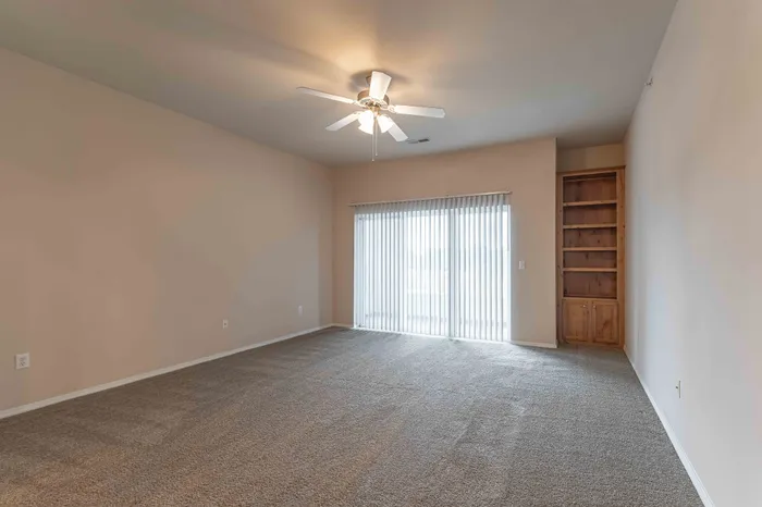 The-Abbey-Apartments-Springfield-Missouri-Three-Bedroom-Deluxe-Living-Room-And-Patio-Doors