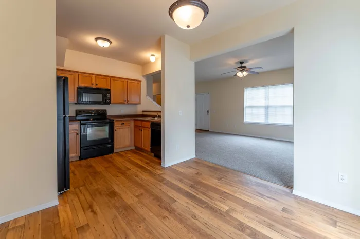 Martin-Riley-Apartment-Homes-Springfield-Missouri-Three-Bedroom-Kitchen-And-Living-Room-View-From-Dining-Room