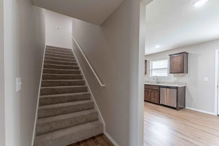Oakwood-Heights-Townhomes-For-Rent-Republic-Missouri-Phase-2-Three-Bedroom-Unit-602-Dining-Space-And-Kitchen-View-From-Staircase