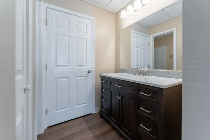 Regency-Towers-Apartments-Rountree-Neighborhood-Springfield-MO-Remodeled-2-Bedroom-Primary-Bathroom-Vanity-Mirror