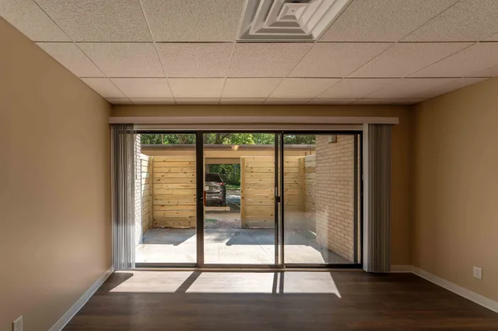 Regency-Towers-Apartments-Rountree-Neighborhood-Springfield-MO-Remodeled-2-Bedroom-Living-Room-Patio-Doors