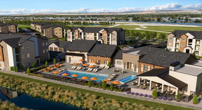 Luxurious apartment complex with stunning pool area, vibrant orange umbrellas, and scenic views, offering a perfect blend of relaxation and modern living.