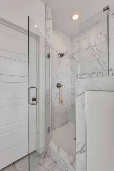 Fully-Custom, Tiled Master Shower Suites