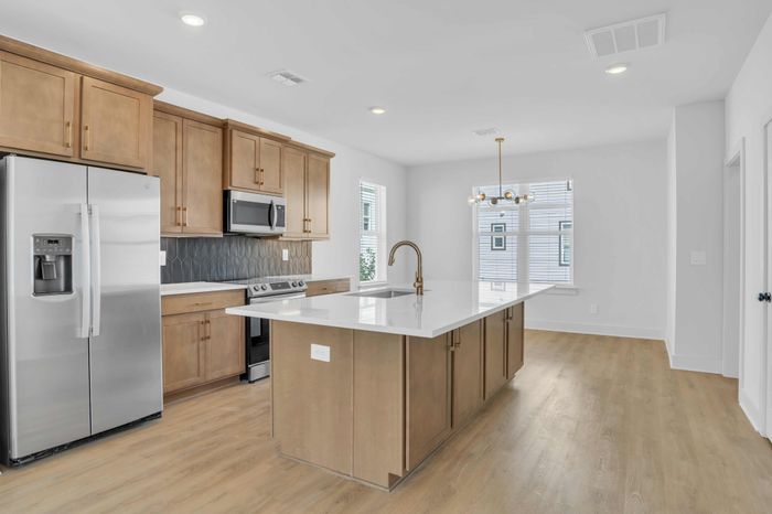 Spacious Kitchen with Modern Finishes and Island