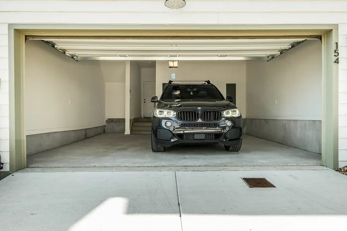Modern spacious garage with sleek design, perfect for accommodating vehicles or extra storage.
