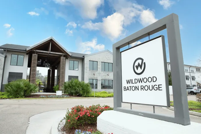 Wildwood Baton Rouge student apartments community entrance and leasing office near LSU