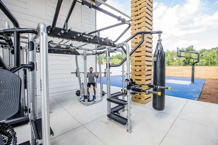 Outdoor strength training equipment and punching bag at Wildwood Baton Rouge student apartments near LSU