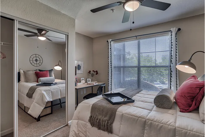 Private bedroom with study desk at The Lodge of Athens student apartments