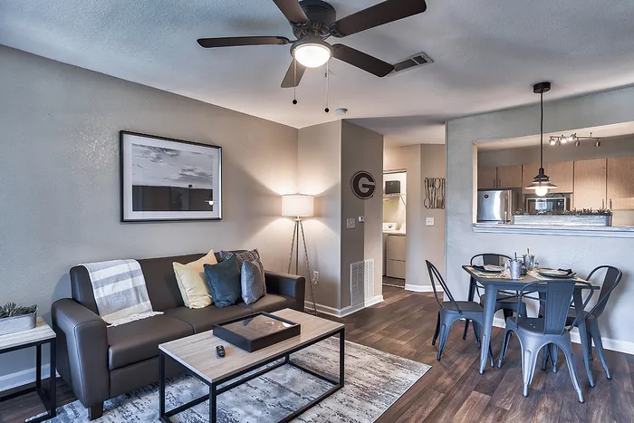 Open living room and dining space at The Lodge of Athens student apartments