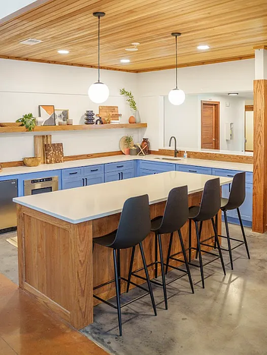 Community kitchen with island seating and modern finishes at The Lodge of Athens