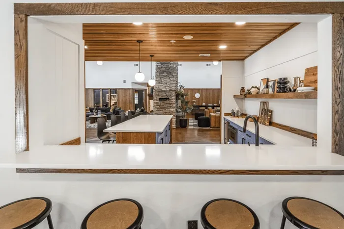 Open community kitchen overlooking clubhouse lounge at The Lodge of Athens