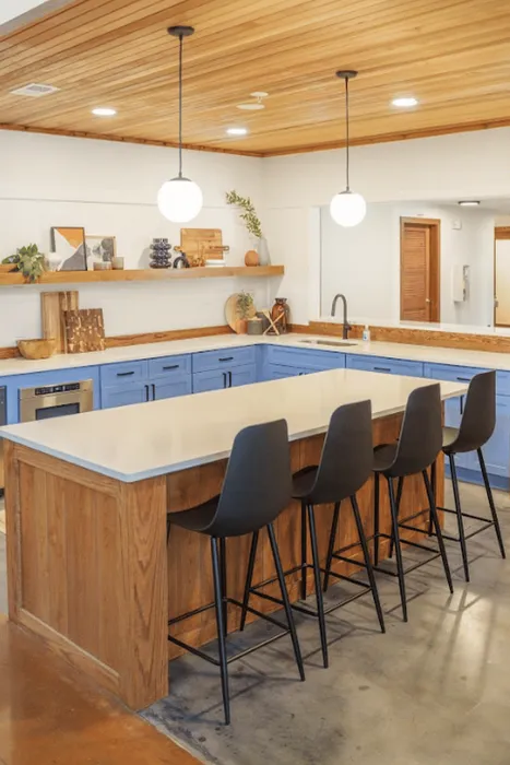 Modern community kitchen with island bar seating at The Lodge of Athen