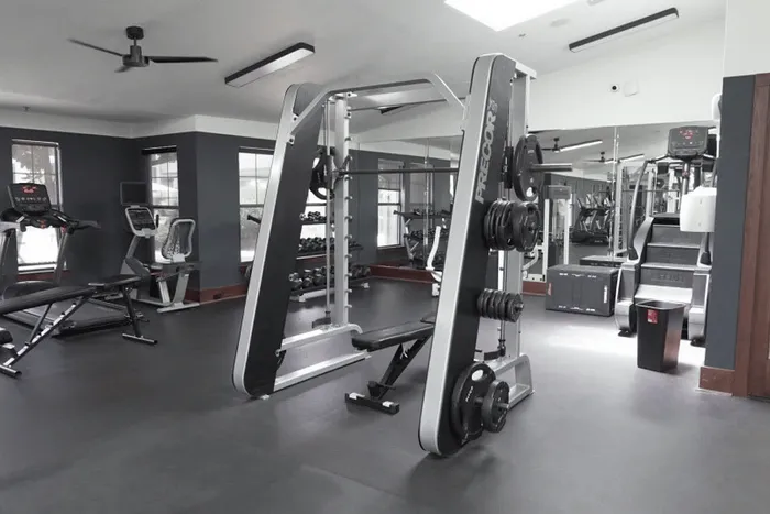 Strength training equipment and weight machines at The Lodge of Athens fitness center
