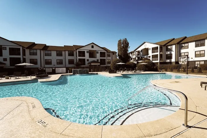 Large resort-style pool with sun deck at The Lodge of Athens