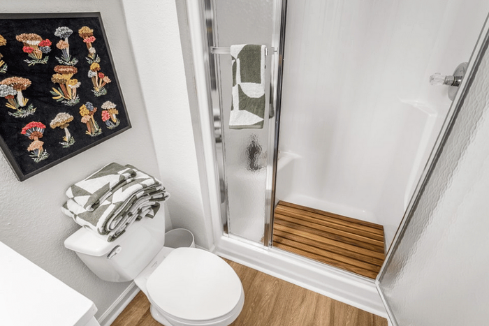 Walk-in shower and bathroom inside a student apartment at The Lodge of Athens