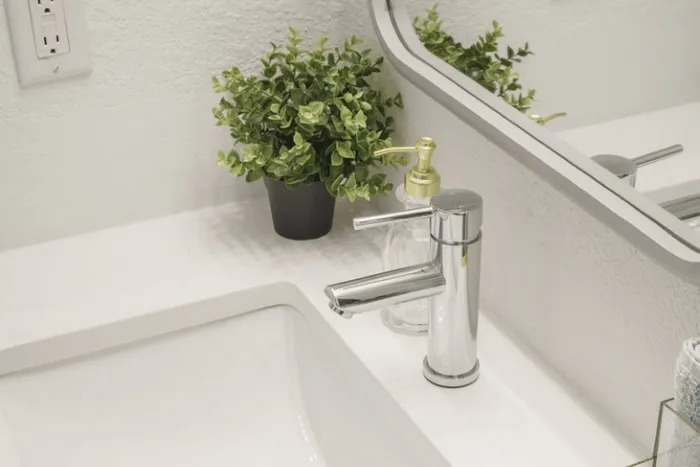 Modern bathroom vanity and sink at The Lodge of Athens student apartments
