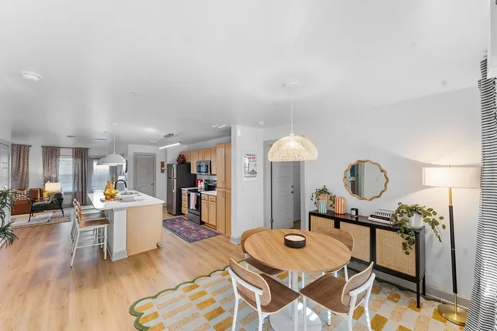 Open concept kitchen, dining, and living area at Wildwood Baton Rouge student apartments near LSU