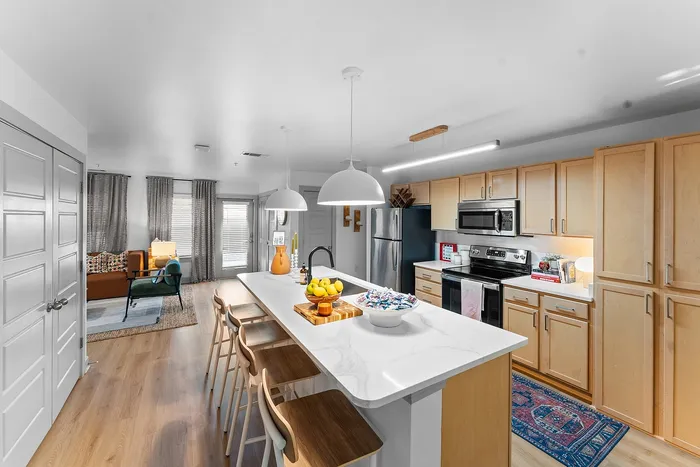 Open concept kitchen and living room at Wildwood Baton Rouge student apartments near LSU
