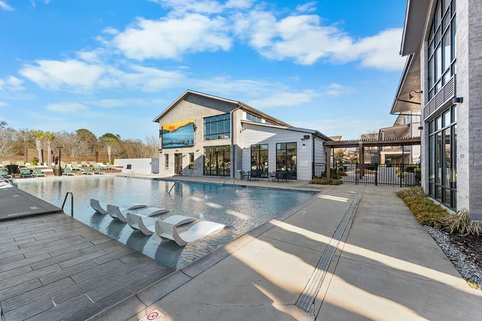 Resort-style pool and clubhouse at Wildwood Baton Rouge student apartments near LSU