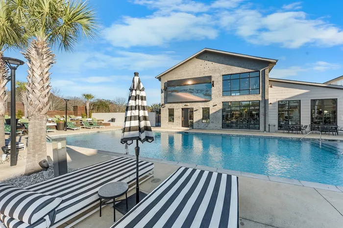 Pool lounge area and clubhouse at Wildwood Baton Rouge student apartments near LSU