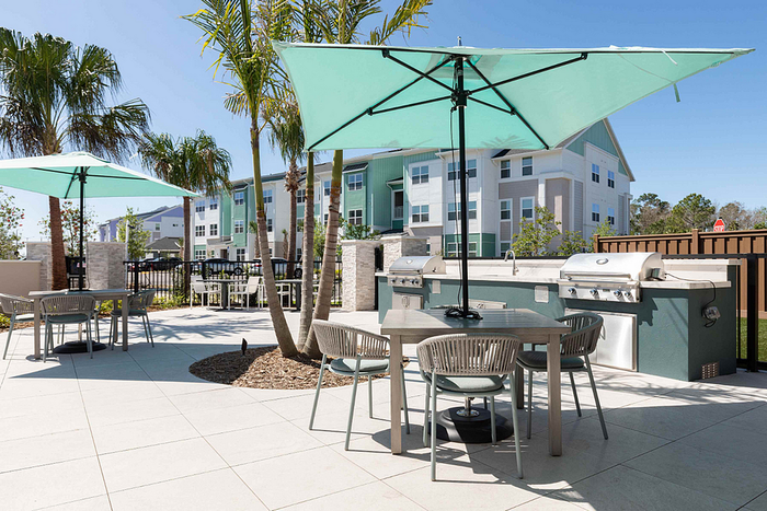 Photos of Lake Nona Concorde apartments in Orlando, FL showcasing modern interiors, luxury amenities, and community spaces