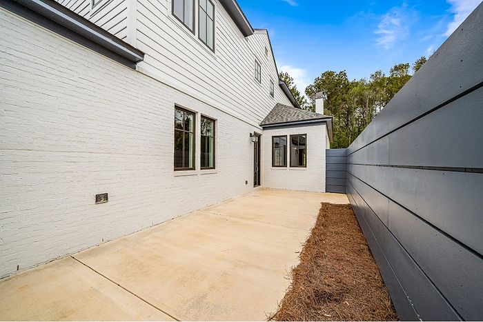 Inviting outdoor patio area with clean lines and modern design, perfect for relaxation and gatherings.