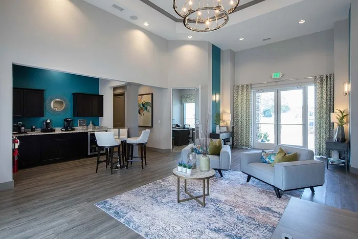 Elegant apartment lobby with modern furnishings, cozy seating, and stylish lighting, offering a welcoming ambiance.