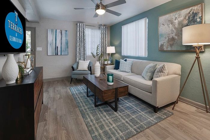 Modern living room in Clearwater Beach apartment featuring stylish decor, chic furniture, and a cozy atmosphere.
