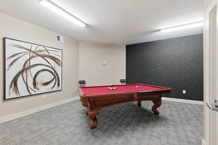 resident lounge with pool table and seating