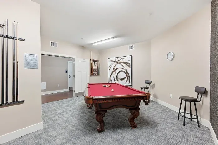 resident lounge with pool table and seating