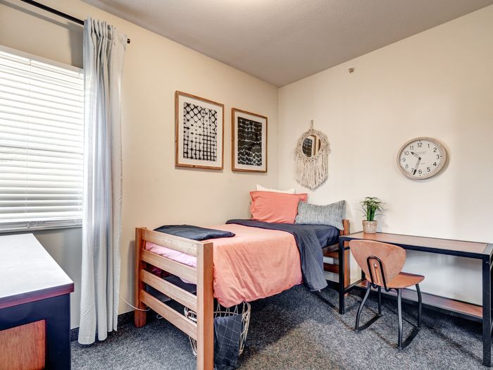 Bed, desk, storage in bedroom in apartment at University Gate | Erie, PA Apartments.