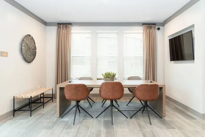 Furnished meeting area with table and chairs