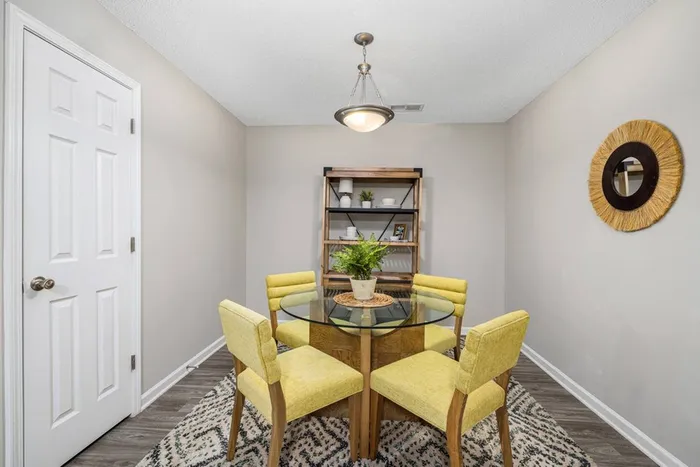 Dining room with table and yellow chairs