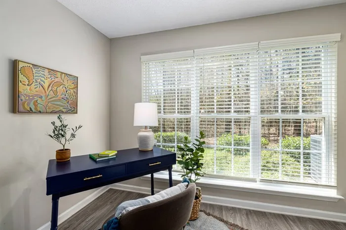 Sun room with writing desk next to windows