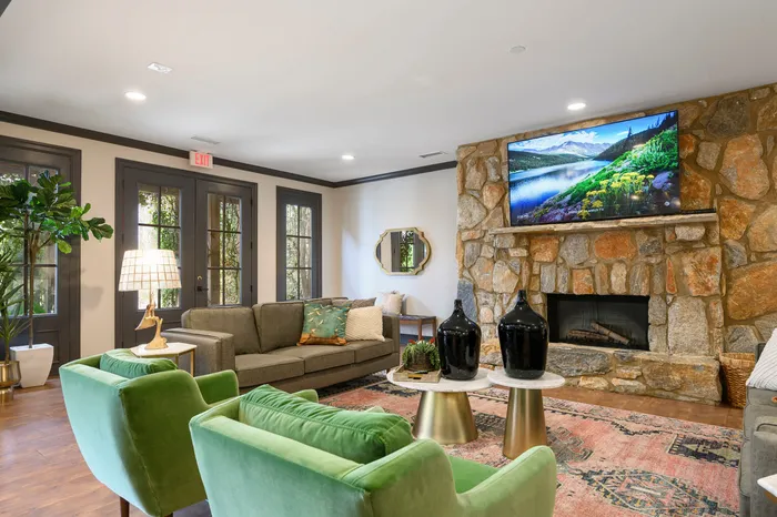 furnished clubroom with fireplace