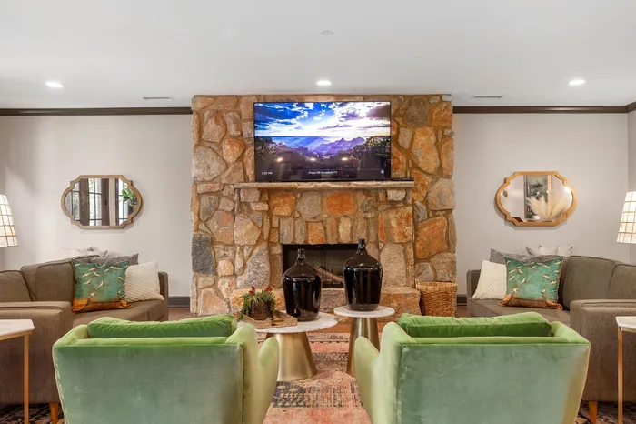 furnished clubroom with fireplace